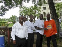 One love: Hell’s Gate panists; one of Gemonites Steel Orchestra founders Vere Henry
  (second from right), and Veron Henry (right) arranger and tuner for Hell’s Gate
