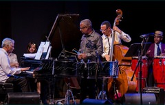 Frankie McIntosh, Garvin Blake, bassist David “Happy” Williams and Étienne Charles on congas