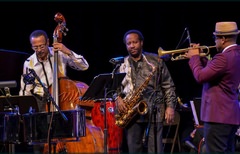 Bassist David “Happy” Williams, saxophonist Charles Daugherty and Étienne Charles