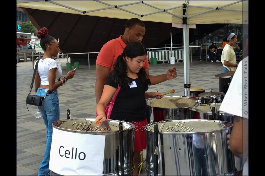 Being introduced to the steelpan instrument, getting a sense of how it is played