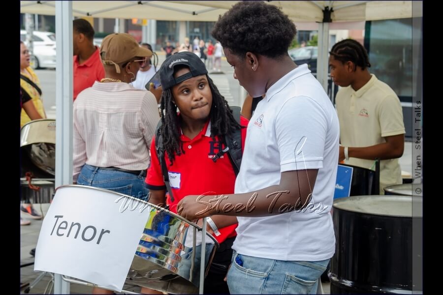 Being introduced to the steelpan instrument, getting a sense of how it is played