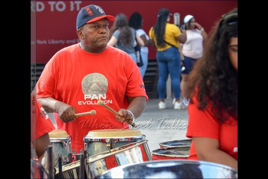 Percussionist Lenny King on congas with Pan Evolution Steel Orchestra