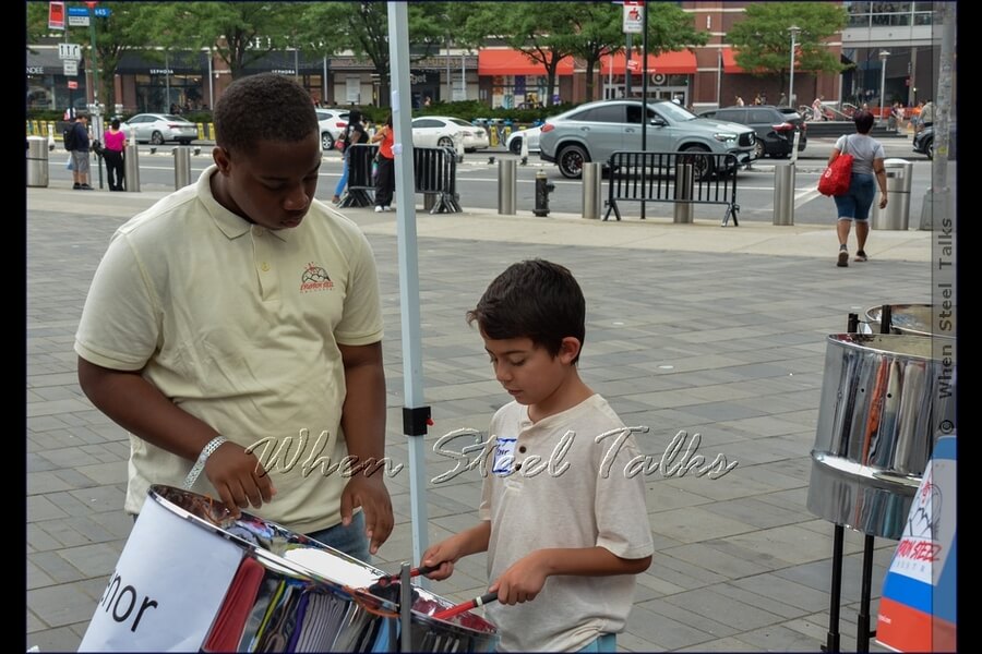 Mini class on steelpan with Eruption Steel Orchestra for an interested youngster