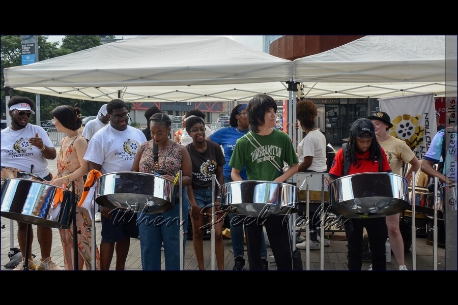 Members of the crowd have another opportunity for a hands-on workshop on the steelpan, this time with Pan In Motion
