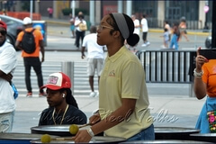 Eruption Steel Orchestra steelpan musician on six-bass