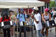 Trying out the steelpan instrument under the guidance of Pan In Motion founder Dr. Kendall K. Williams
