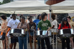 Members of the crowd have another opportunity for a hands-on workshop on the steelpan, this time with Pan In Motion