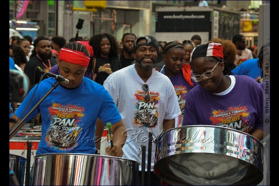 Wayne Bernard, at center, in white - leader of Pan Evolution Steel Orchestra
