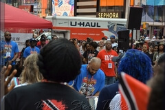 Tristan Japsi (center in image) performs both the anthems of the United States of America and Trinidad and Tobago