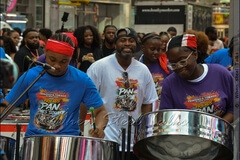Wayne Bernard, at center, in white - leader of Pan Evolution Steel Orchestra