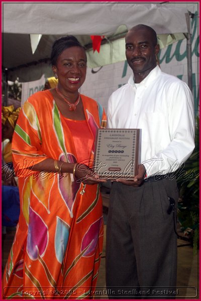 Culture Minister Joan Yuille-Williams presents Eloy Burge with his award for Community Service.jpg